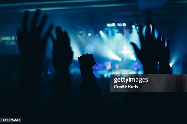 hands in worship - praising religion stock pictures, royalty-free photos & images