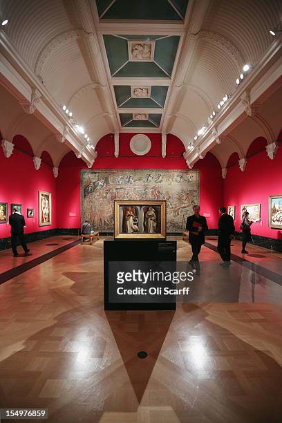 Members of the public admire paintings in the exhibition 'The Northern Renaissance: Durer to Holbein' at The Queen's Gallery on October 29, 2012 in...