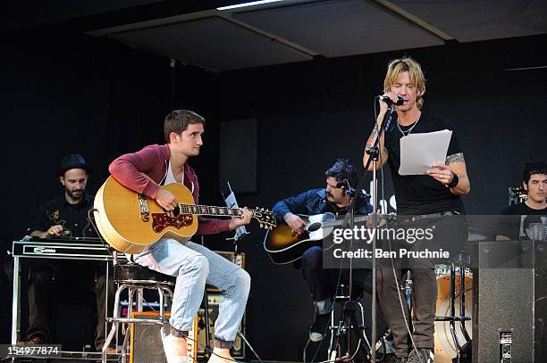 Duff McKagan performs with wounded soldier Danny O'Connor through the Help for Heroes charity on October 29, 2012 in London, England.