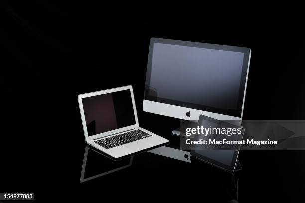 Apple Macbook Air laptop, iMac desktop computer and iPad 2 tablet computer, photographed during a studio shoot for Mac Format Magazine, March 27,...