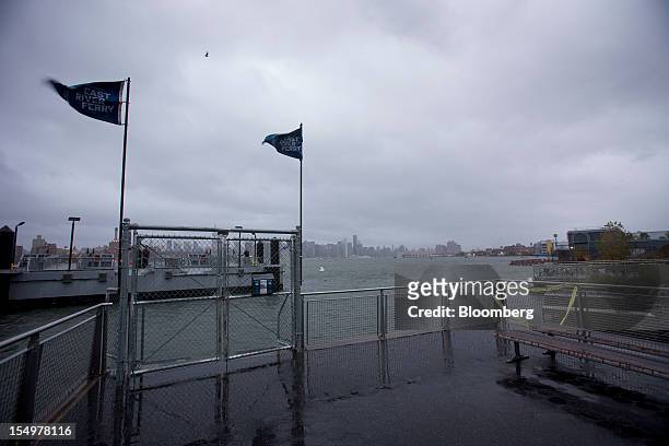 The gates to the East River Ferry sit closed in New York, U.S., on Monday, Oct. 29, 2012. Hurricane Sandy strengthened on its path toward New Jersey,...