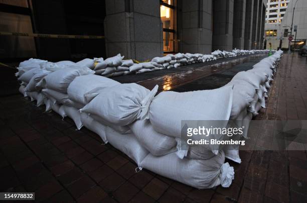 Sandbags are stacked next to a building on Pearl Street in preparation for Hurricane Sandy in New York, U.S., on Monday, Oct. 29, 2012. Hurricane...