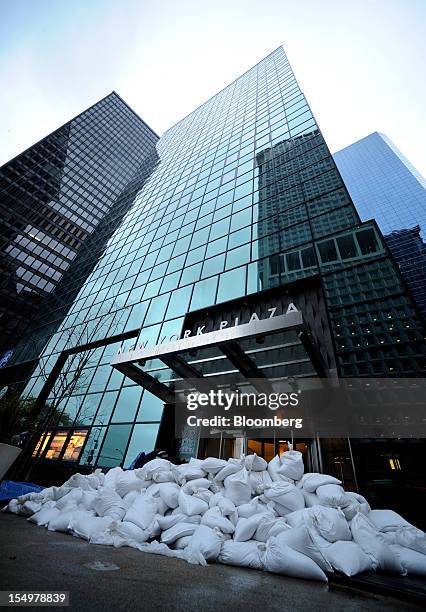 Sandbags are stacked at a building entrance on Water Street in preparation for Hurricane Sandy in New York, U.S., on Monday, Oct. 29, 2012. Hurricane...