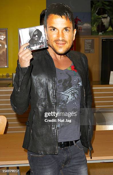 Peter Andre meets fans and signs copies of his album 'Angels & Demons' on October 29, 2012 in St Albans, England.