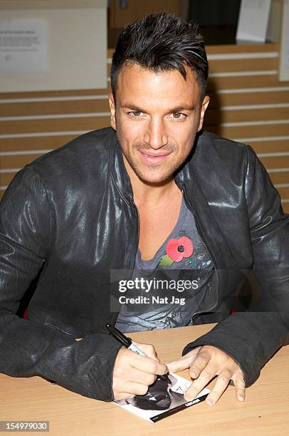 Peter Andre meets fans and signs copies of his album 'Angels & Demons' on October 29, 2012 in St Albans, England.