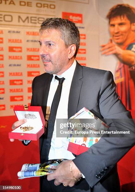 Lionel Messi's father Jorge Horario Messi holding the Golden Bootee for his future grandson during the ceremony of the European Golden Boot 2012...