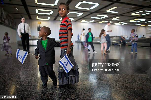 New Jewish immigrant children during a welcoming ceremony after arriving on a flight from Ethiopia, on October 29, 2012 at Ben Gurion airport near...