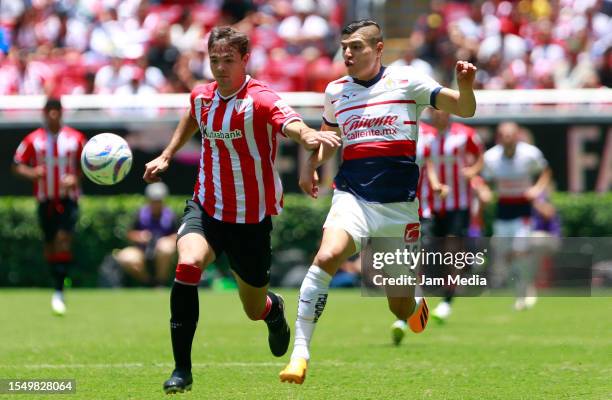 Daniel Vivian of Athletic Club fights for the ball with Ronaldo Cisneros of Chivas during the friendly match between Chivas and Athletic Club at...