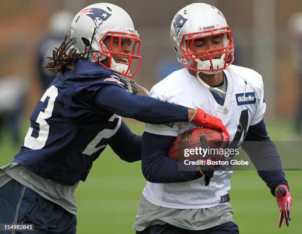 New England Patriots running back Shane Vereen protects the ball as New England Patriots defensive back Marquice Cole tries to dislodge it during a...