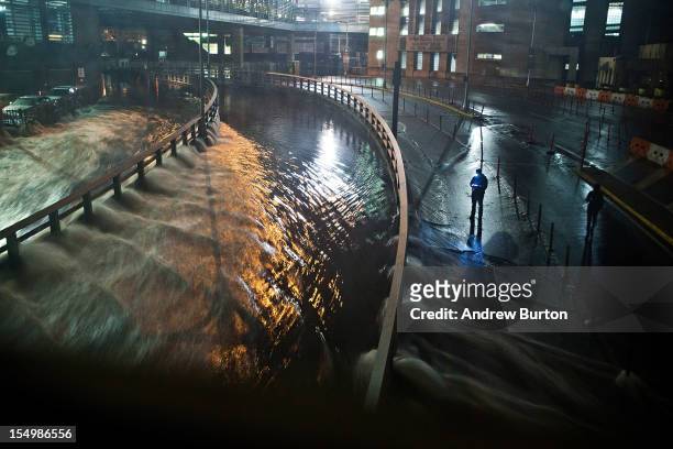Water rushes into the Carey Tunnel , caused by Hurricane Sandy, October 29 in the Financial District of New York, United States. Hurricane Sandy,...