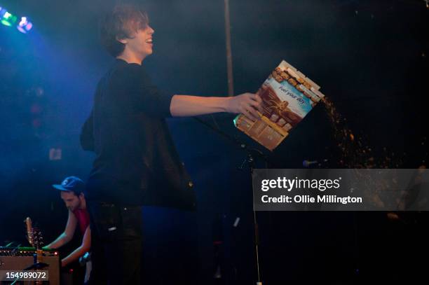 Jordan Gatesmith of Howler throws out breakfast cereal into the crowd while he performs on stage during a date of the NME Magazine New Generation...