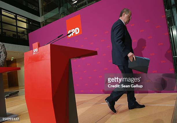 German Social Democrat and candidate for Chancellor Peer Steinbrueck departs after speaking to the media to announce a full disclosure of his...