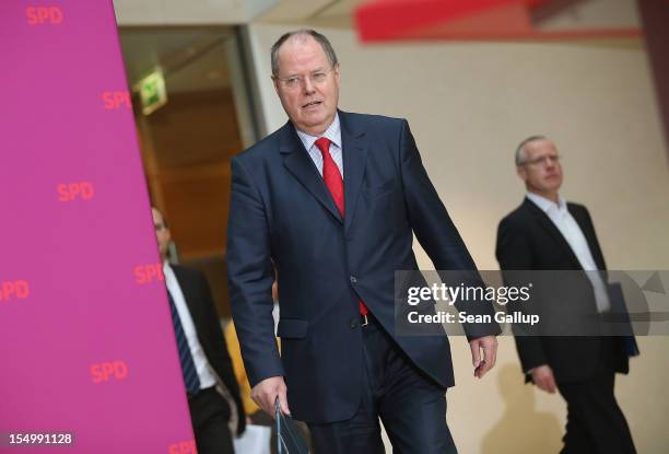 German Social Democrat and candidate for Chancellor Peer Steinbrueck arrives to speak to the media to announce a full disclosure of his supplementary...