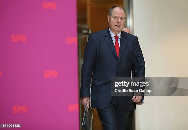 German Social Democrat and candidate for Chancellor Peer Steinbrueck arrives to speak to the media to announce a full disclosure of his supplementary...