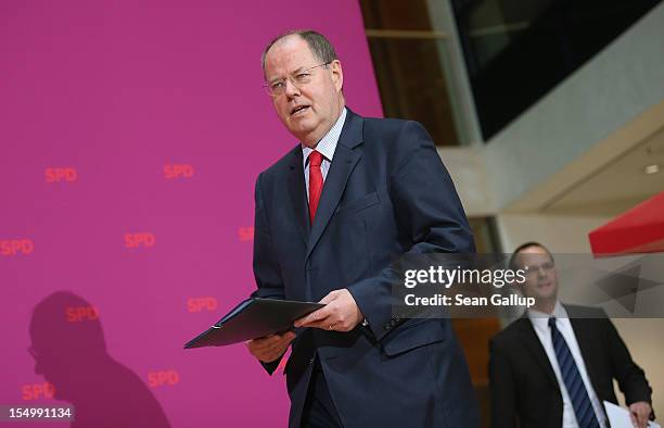 German Social Democrat and candidate for Chancellor Peer Steinbrueck arrives to speak to the media to announce a full disclosure of his supplementary...