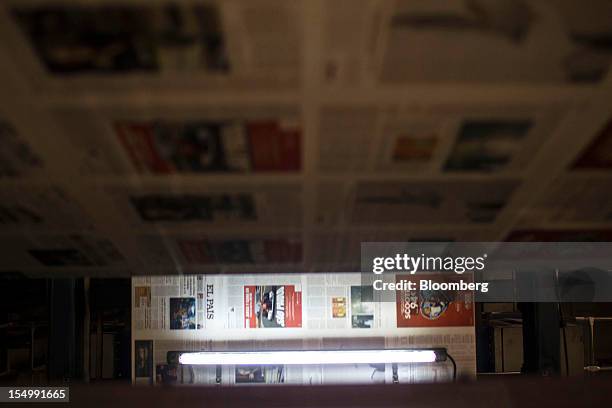 El Pais newspapers run through printing presses at the El Pais printing plant in Madrid, Spain, on Tuesday, Oct. 30, 2012. Prisa, the publisher of El...