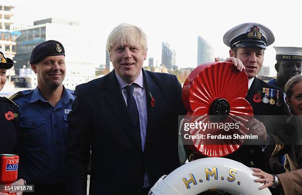 Mayor of London Boris Johnson attends a photocall to launch the largest ever London Poppy Day, aboard HMS Severn on October 30, 2012 in London,...