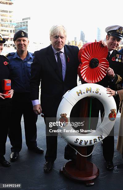 Mayor of London Boris Johnson attends a photocall to launch the largest ever London Poppy Day aboard HMS Severn on October 30, 2012 in London,...