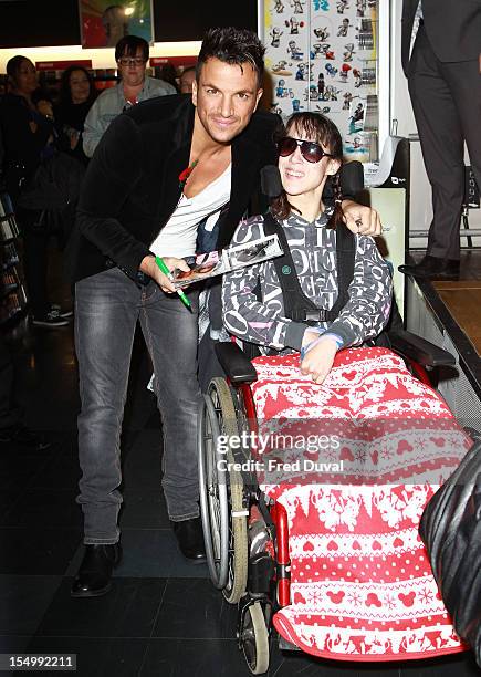 Peter Andre meets fans and signs copies of his album 'Angels & Demons' at HMV, Oxford Street on October 30, 2012 in London, England.