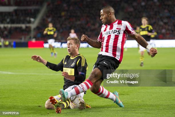 Per Karlsson of AIK Solna, Jeremain Lens of PSV during the Europa League match between PSV Eindhoven and AIK Solna at the Philips Stadium on October...