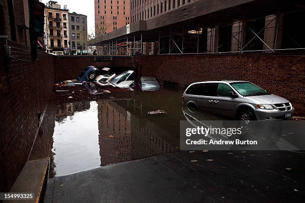 Cars floating in a flooded subterranian basement following Hurricaine Sandy on October 30, 2012 in the Financial District of New York, United States....