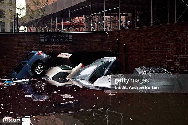 Cars floating in a flooded subterranian basement following Hurricaine Sandy on October 30, 2012 in the Financial District of New York, United States....