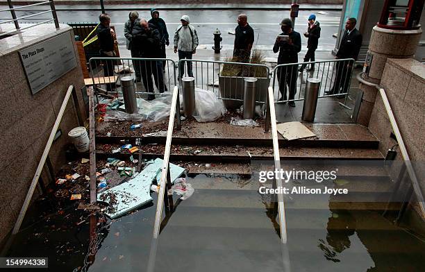 Water floods the Plaza Shops October 30, 2012 in lower Manhattan, New York. The storm has claimed at least 33 lives in the United States, and has...