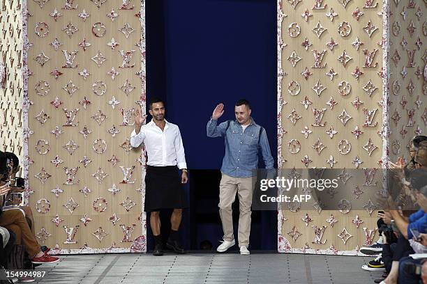 Tokyo, Japan. 21st Apr, 2016. British fashion designer Kim Jones poses for  the cameras during the opening celebration for Louis Vuitton's ''Volez,  Voguez, Voyagez'' exhibition on April 21, 2016, Tokyo, Japan. After