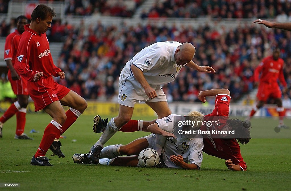 Alan Smith of Leeds United on the ground with Jonahtan Greening of ...