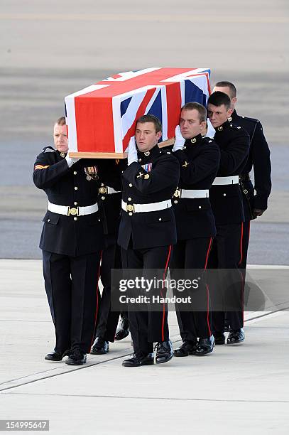 In this handout image supplied by the Ministry of Defence , the repatriation ceremony takes place for Corporal David O'Connor from 40 Commando Royal...