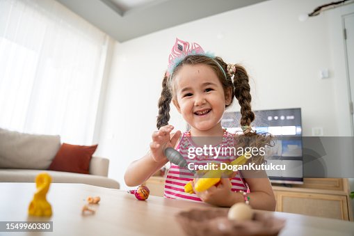 Beautiful baby girl playing with plastic dinosaur toy Beautiful baby girl playing with plastic dinosaur toy