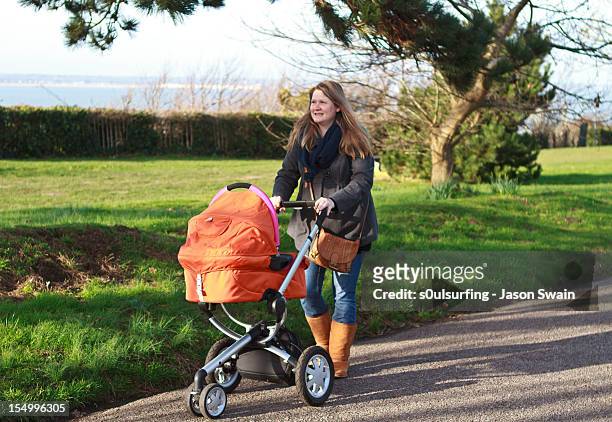 taking baby for a walk. - s0ulsurfing stock pictures, royalty-free photos & images