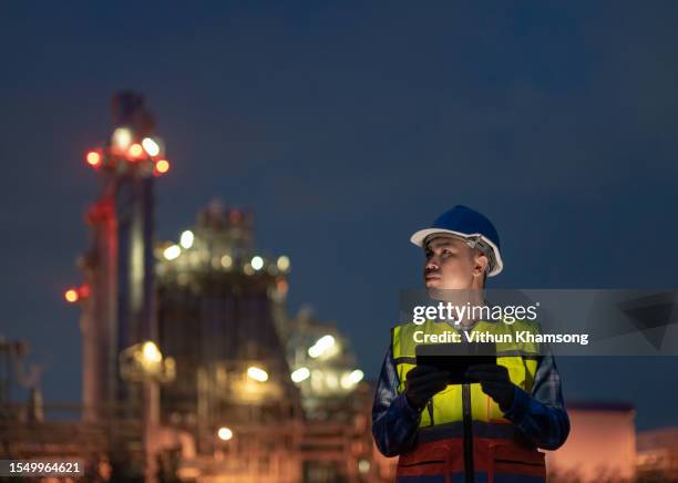 engineer and tablet working at power station or oil and gas pant - gas plant sunset stock pictures, royalty-free photos & images