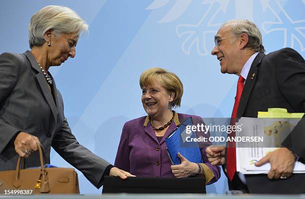 German Chancellor Angela Merkel , Christine Lagarde , managing director of the International Monetary Fund , and the secretary general of the...