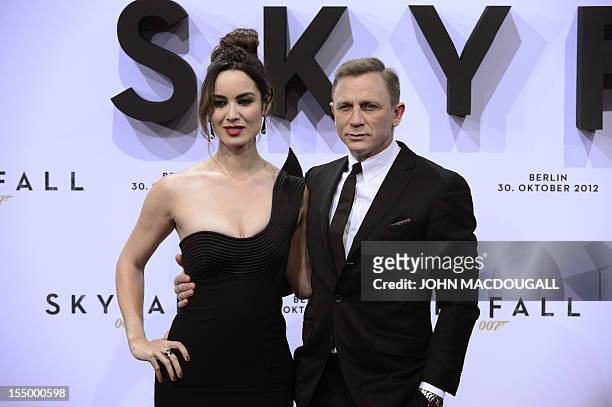 British actor Daniel Craig and French actress Berenice Marlohe pose as they arrive for the German premiere of the new James Bond movie "Skyfall" in...