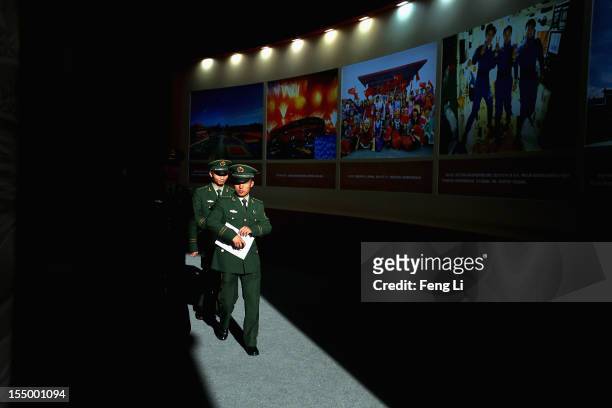 The paramilitary policemen visit an exhibition entitled "Scientific Development and Splendid Achievements" before the18th National Congress of the...