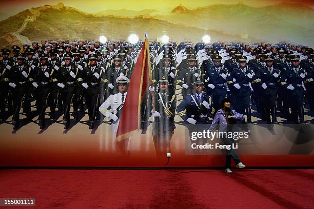 Woman poses for photo during an exhibition entitled "Scientific Development and Splendid Achievements" before the18th National Congress of the...