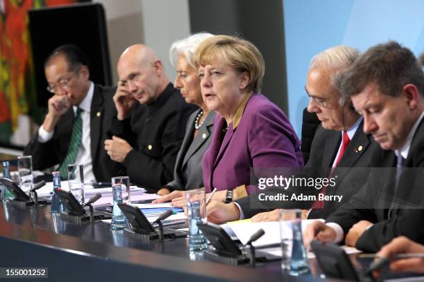 Jim Yong Kim, president of the World Bank, Pascal Lamy, director-general of the World Trade Organization , Christine Lagarde, managing director of...