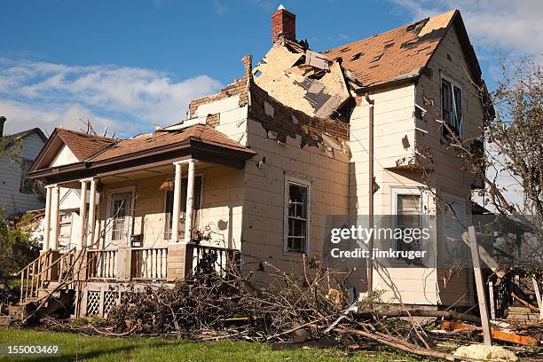 tornado battered home severely damaged. - broken tree stock pictures, royalty-free photos & images