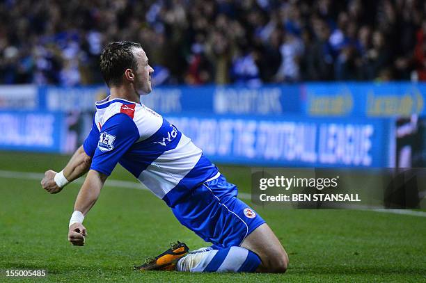 Reading's Irish striker Noel Hunt celebrates after scoring their fourth goal during the English League Cup Fourth Round football match between...