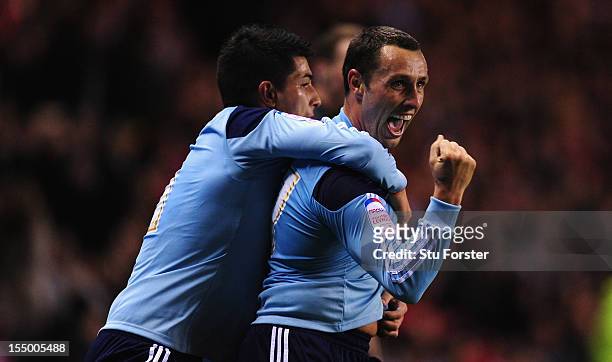 Middlesbrough forward Scott Mcdonald celebrates his opening goal with Emmanuel Ledesma during the Capital One Cup Fourth Round match between...