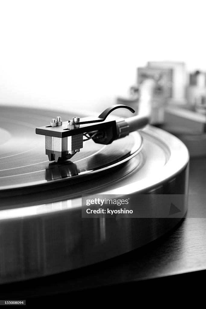 Black and White photography of Record Player against white background