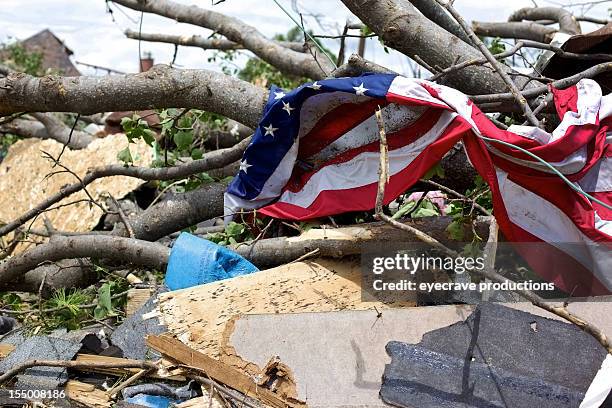joplin missouri deadly f5 tornado debris piled and american flag - joplin missouri bildbanksfoton och bilder