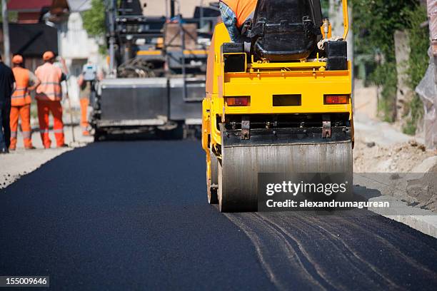 asphalt paving - road works stock pictures, royalty-free photos & images