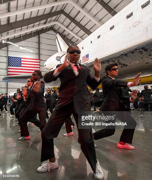 In this handout image supplied by NASA, Members of the Debbie Allen Dance Academy perform "Men in Black" choreographed by Debbie Allen during the...