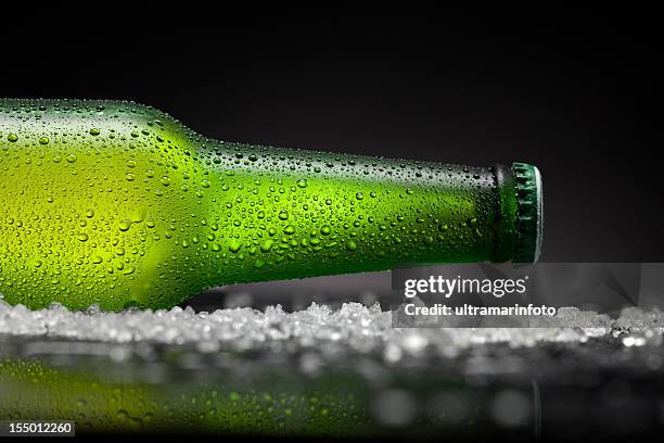 ice cold beer bottle - beer bottle stock pictures, royalty-free photos & images