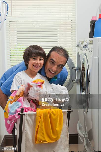 laundry - man washing basket child stock pictures, royalty-free photos & images