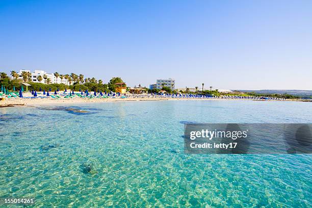 beautiful clear blue sea at macronissos beach in cyprus - cyprus stockfoto's en -beelden