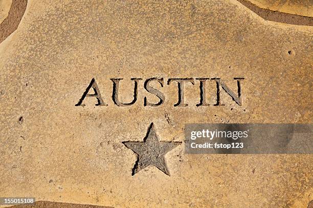 austin, texas shown on map of concrete. star, state capitol. - austin texas park stock pictures, royalty-free photos & images