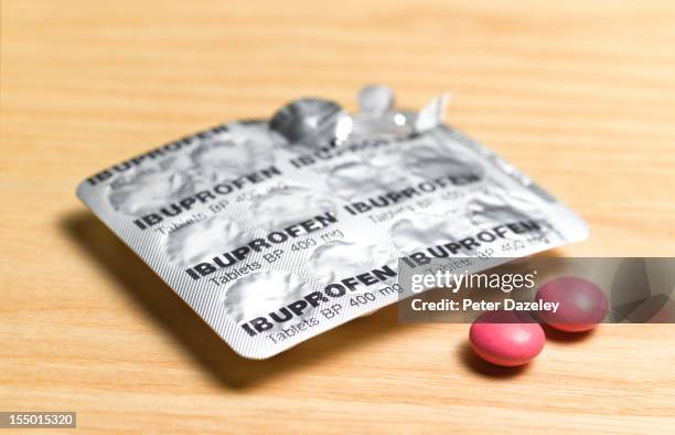 ibuprofen pain relief tablets - ibuprofen stock pictures, royalty-free photos & images